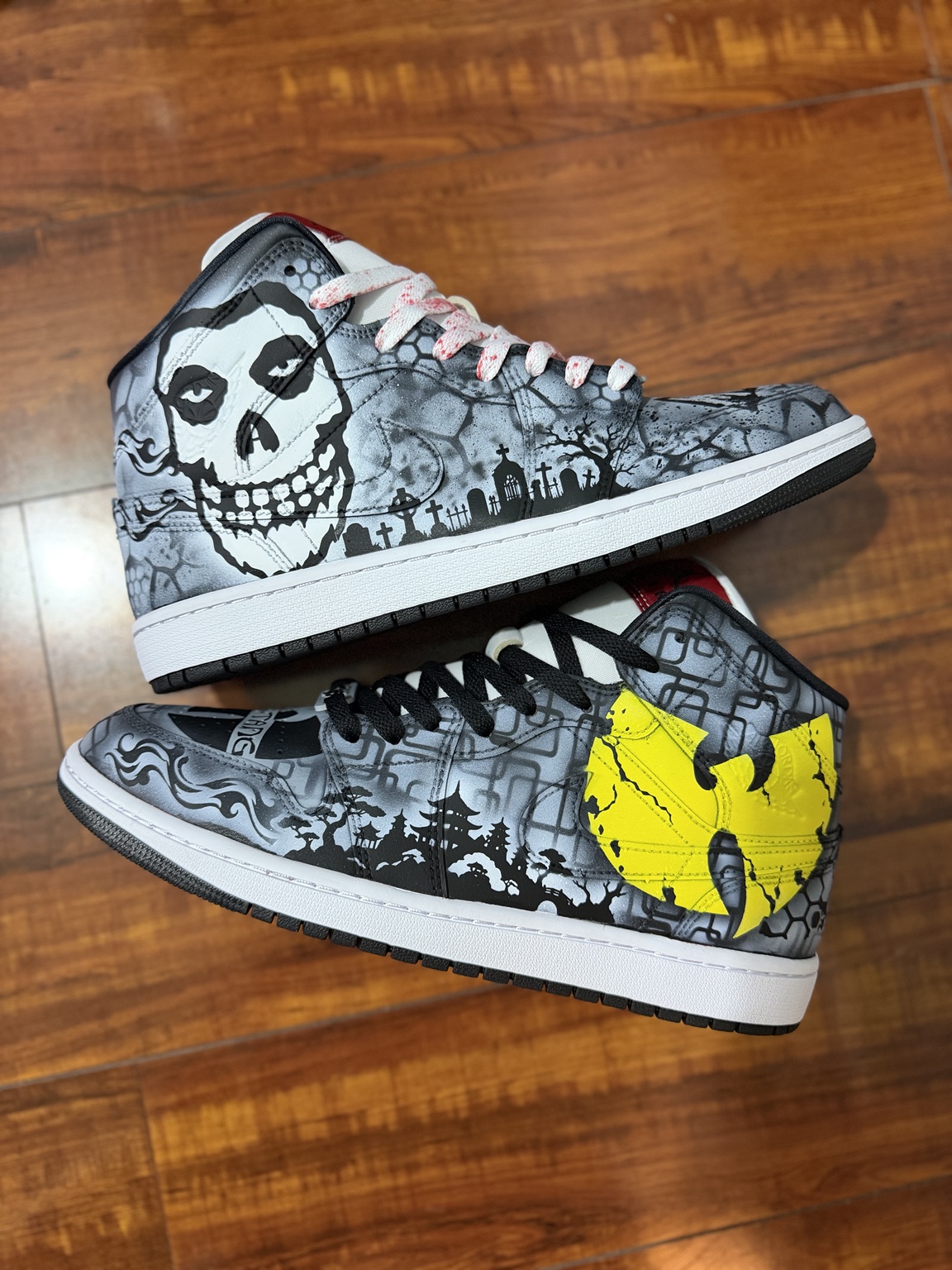 Black and gray horror themed high top sneakers with yellow emblem